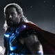 Thor in shadow with glowing blue lights around his torso.